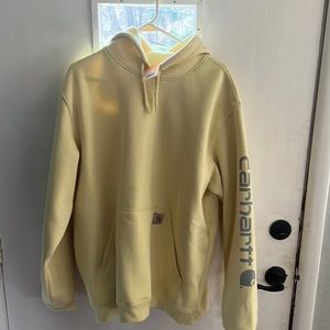 Carhartt loose fit hoodie. The color is lemon grass.